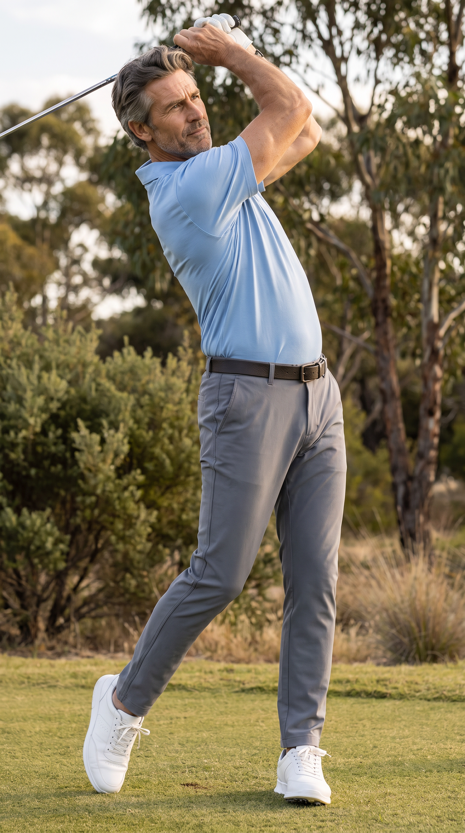 Golfer at the top of the backswing in MotionFlex performance pants